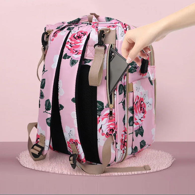 Poche zippee dissimulee au dos du sac pour garder telephone et objets de valeur en securite pres de soi.