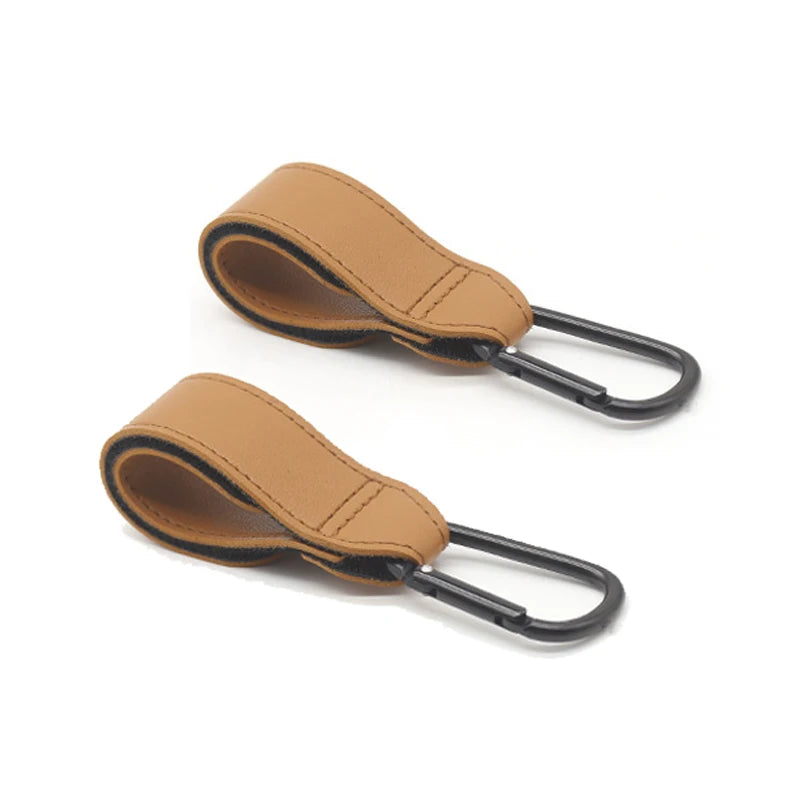 Lot de deux attaches camel offrant un rendu cuir chaleureux pour equiper la poussette.