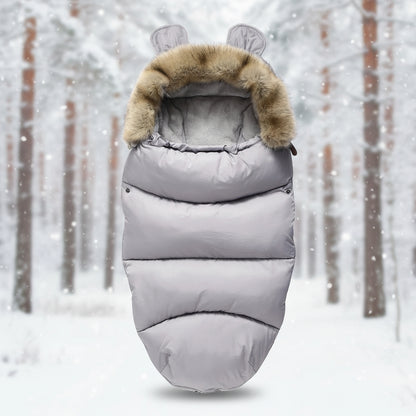 Chanceliere pour bebe en poussette coloris gris uni avec interieur en polaire moelleuse pour affronter les sorties par grand froid.