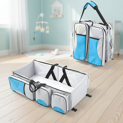 Sac a langer convertible en lit nomade coloris bleu et gris, ideal pour les sorties et deplacements avec bebe.