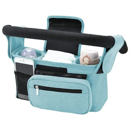 Organisateur de poussette en bleu clair avec pattes velcro reglables pour s'adapter a la plupart des guidons.