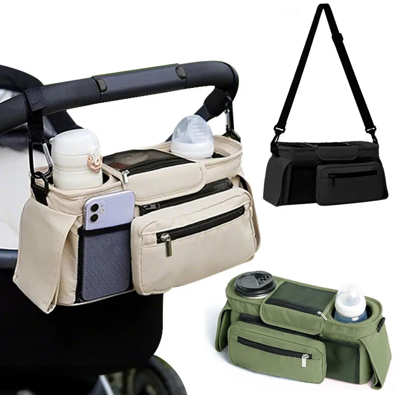 Organisateur de poussette decline en beige, noir et vert kaki, fixe au guidon avec bandouliere pour le transport.