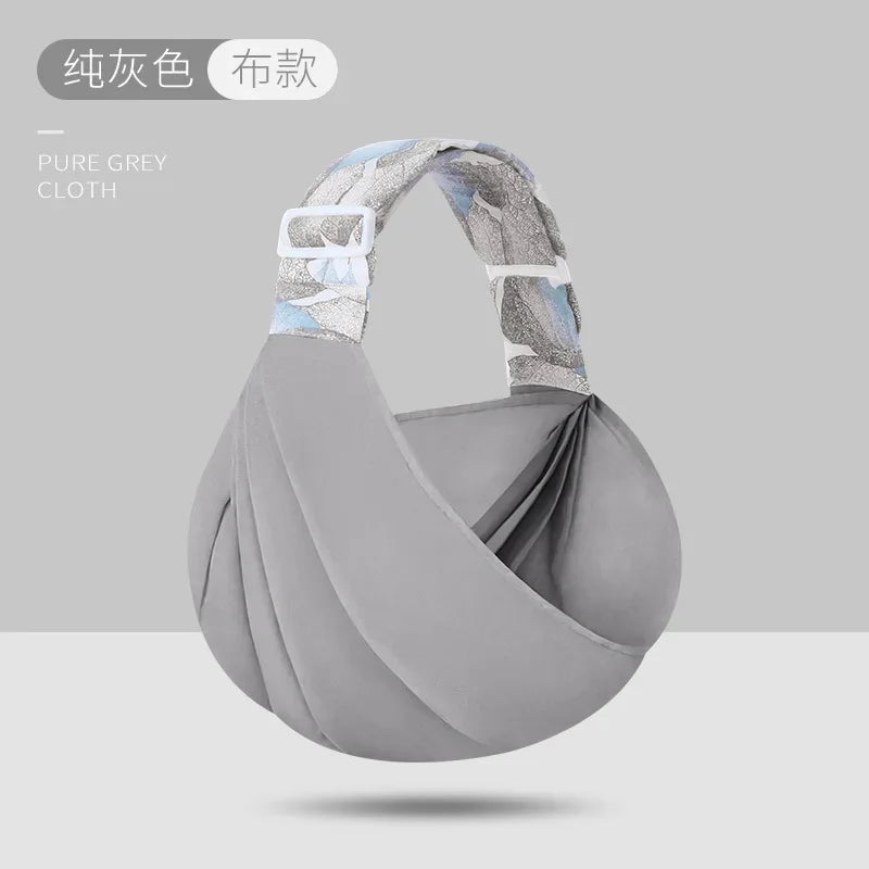 Porte bebe en bandoulière gris en tissu, coloris neutre et elegant qui s'accorde a toutes les tenues
