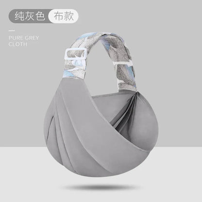 Porte bebe en bandoulière gris en tissu, coloris neutre et elegant qui s'accorde a toutes les tenues