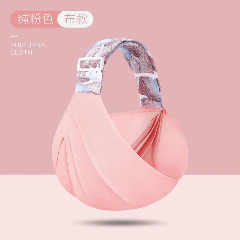Porte bebe en bandoulière rose en tissu doux, ideal pour porter bebe confortablement en toute saison
