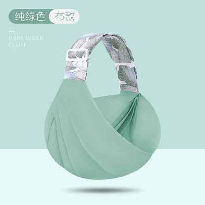 Porte bebe en bandoulière vert d'eau en tissu doux, teinte apaisante et matiere agreable au contact de bebe