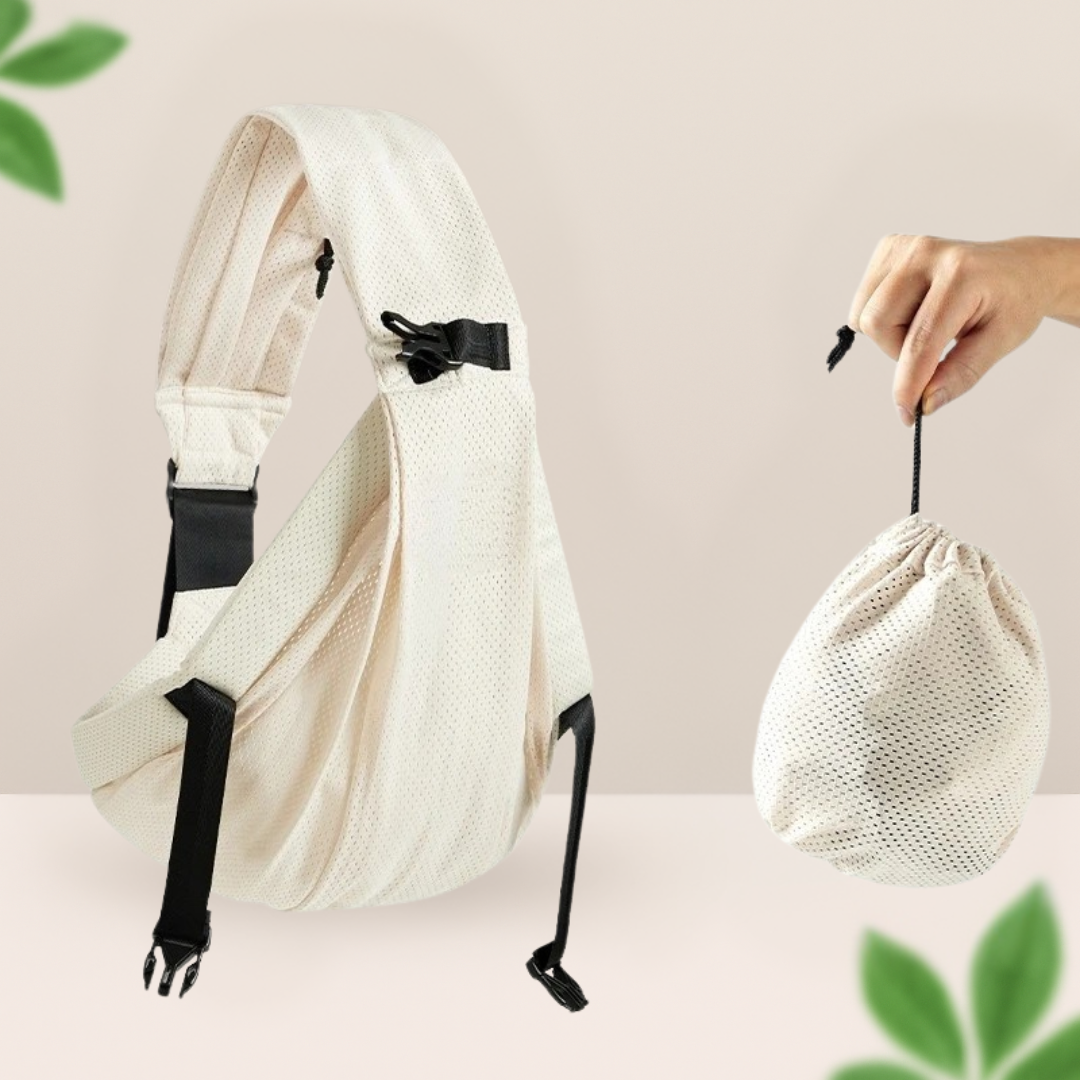 Porte-bebe sling ecru en maille aeree accompagne de sa pochette de transport pliable, parfait pour les sorties par temps chaud.