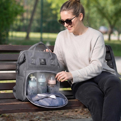 Sac à dos à langer avec système d'accroche poussette