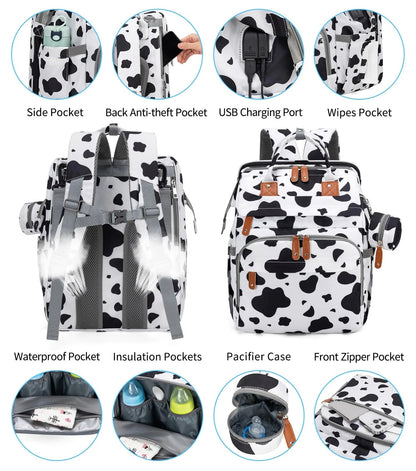 Details des fonctionnalites en version motif vache : poche isotherme, port USB, etui a tetine et compartiment anti-vol dorsal.