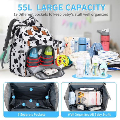Version motif vache avec 55 litres de capacite et 19 poches pour garder toutes les affaires de bebe bien rangees.