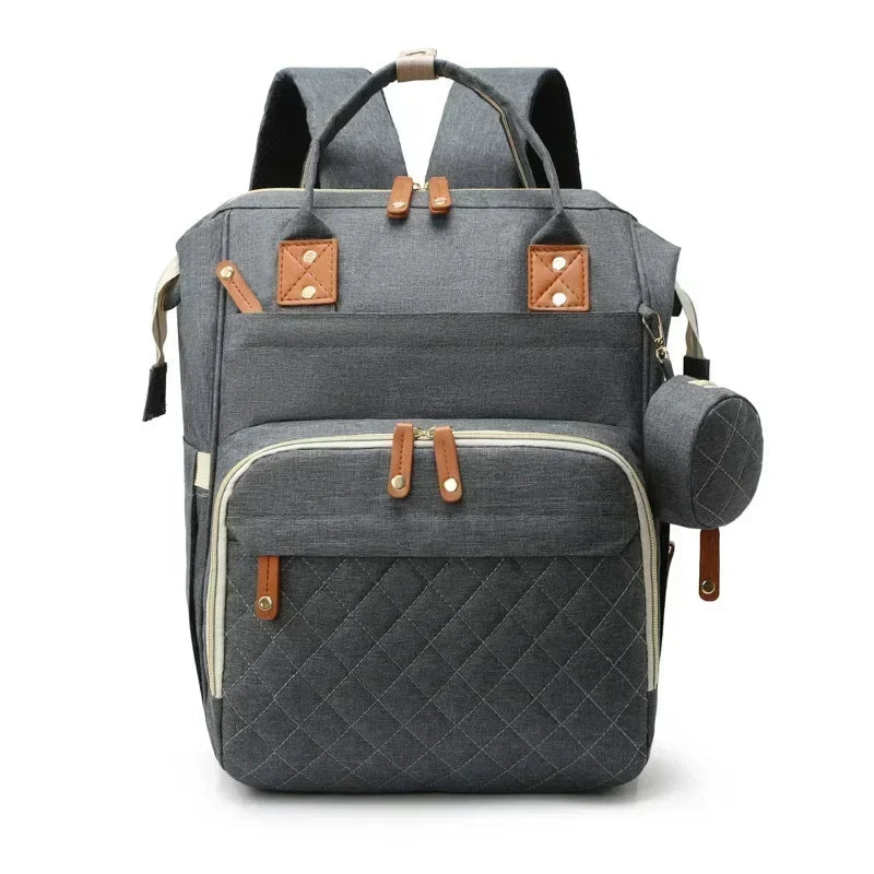 Sac a dos a langer avec lit en gris anthracite, dos aere et bretelles rembourrees pour un portage confortable toute la journee.