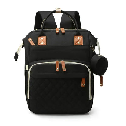 Sac a dos a langer avec lit en noir sobre et chic, parfait pour les parents qui aiment la discretion et la polyvalence.