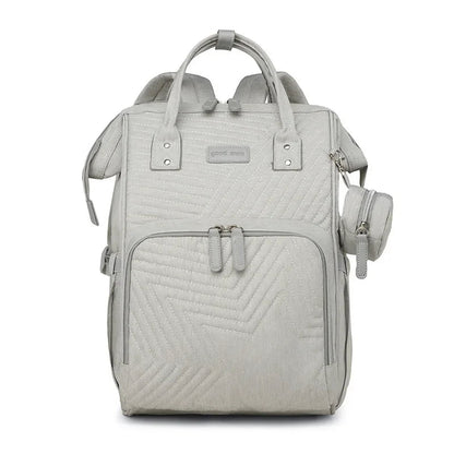 Sac a langer a dos beige ecru au style epure, ideal pour les parents en quete de sobriete.