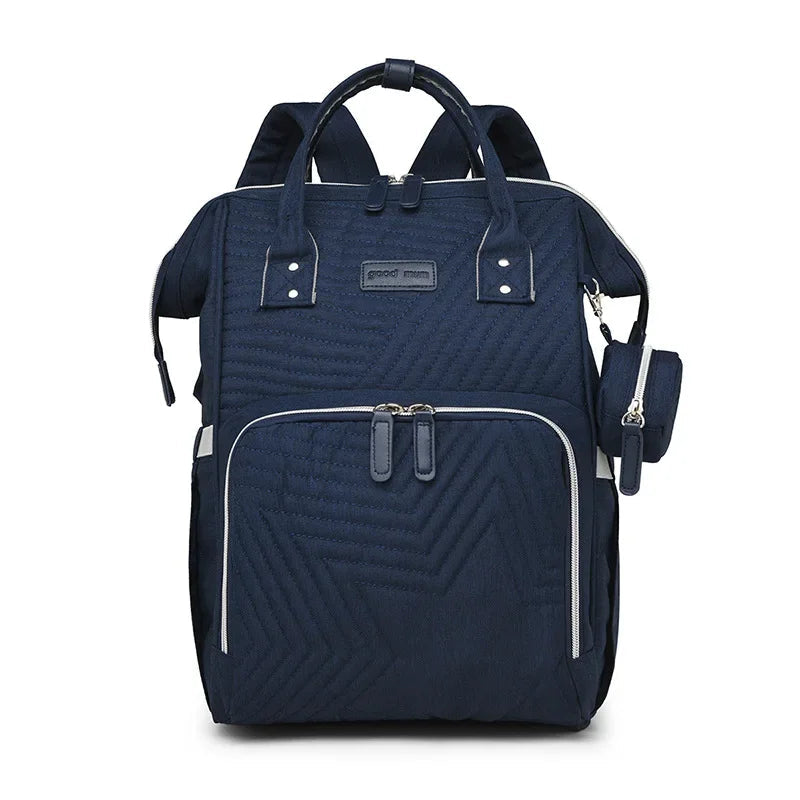Sac a langer a dos bleu marine elegant et intemporel, adapte aussi bien aux mamans qu'aux papas.