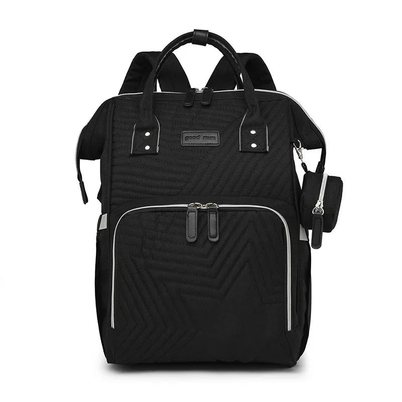 Sac a langer a dos noir dote de bandes reflechissantes pour plus de securite lors des sorties en soiree.