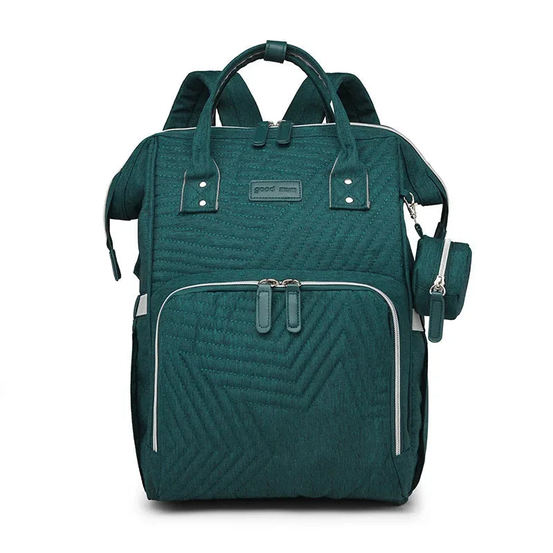 Sac a langer a dos vert emeraude au caractere affirme pour se demarquer lors des balades.