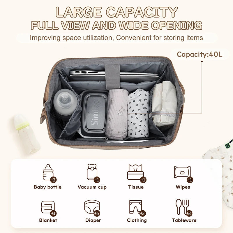 Interieur spacieux de 40 litres a large ouverture accueillant biberons, boites repas, couches et vetements pour toute une journee de sortie avec bebe.