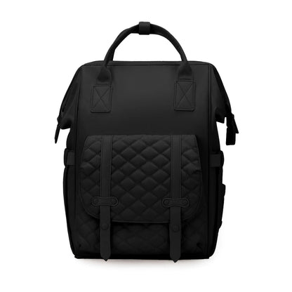 Sac a langer a dos coloris noir elegant, avec sa poche avant matelasse et ses boucles, parfait pour un look sobre et raffine.