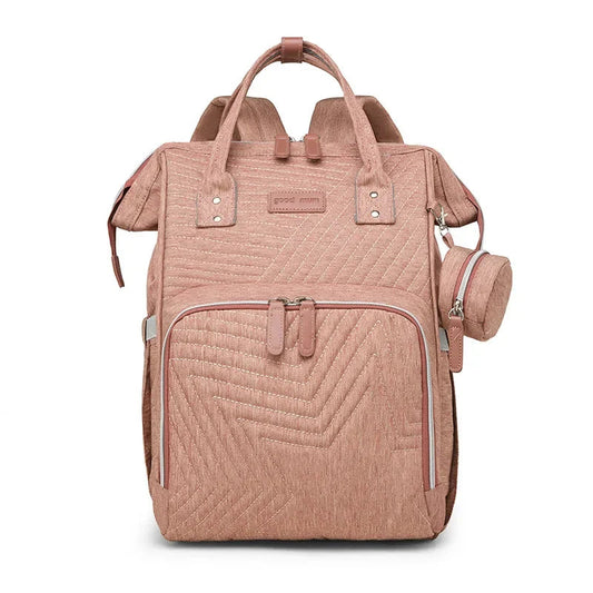 Sac a langer a dos rose matelasse avec sa pochette a tetine assortie, vue de face sur fond blanc.