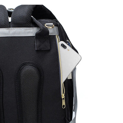 Poche zippee dissimulee dans le dos du sac pour garder telephone et objets de valeur en securite pendant les deplacements.