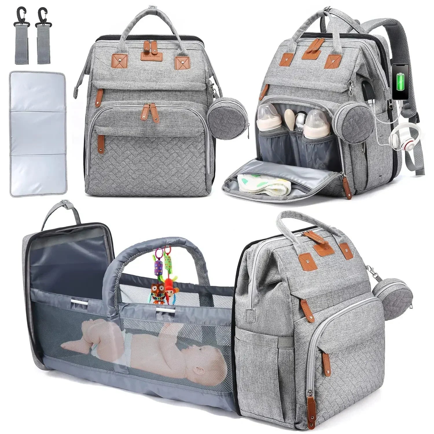 Sac a langer gris equipe d'un port USB, d'une poche isotherme a biberons et d'un berceau depliable avec arceau de jeu pour installer bebe en deplacement.