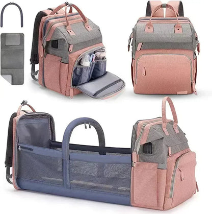 Sac a langer lit nomade bicolore rose et gris vu de face, de dos et deplie en berceau, ideal pour les parents en voyage avec bebe.