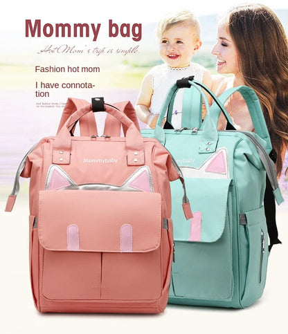 Duo de sacs a langer rose et vert menthe au design tendance porte facilement par les jeunes mamans actives