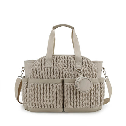 Sac a langer beige spacieux avec poches exterieures et pochette tetine, coloris neutre passe partout