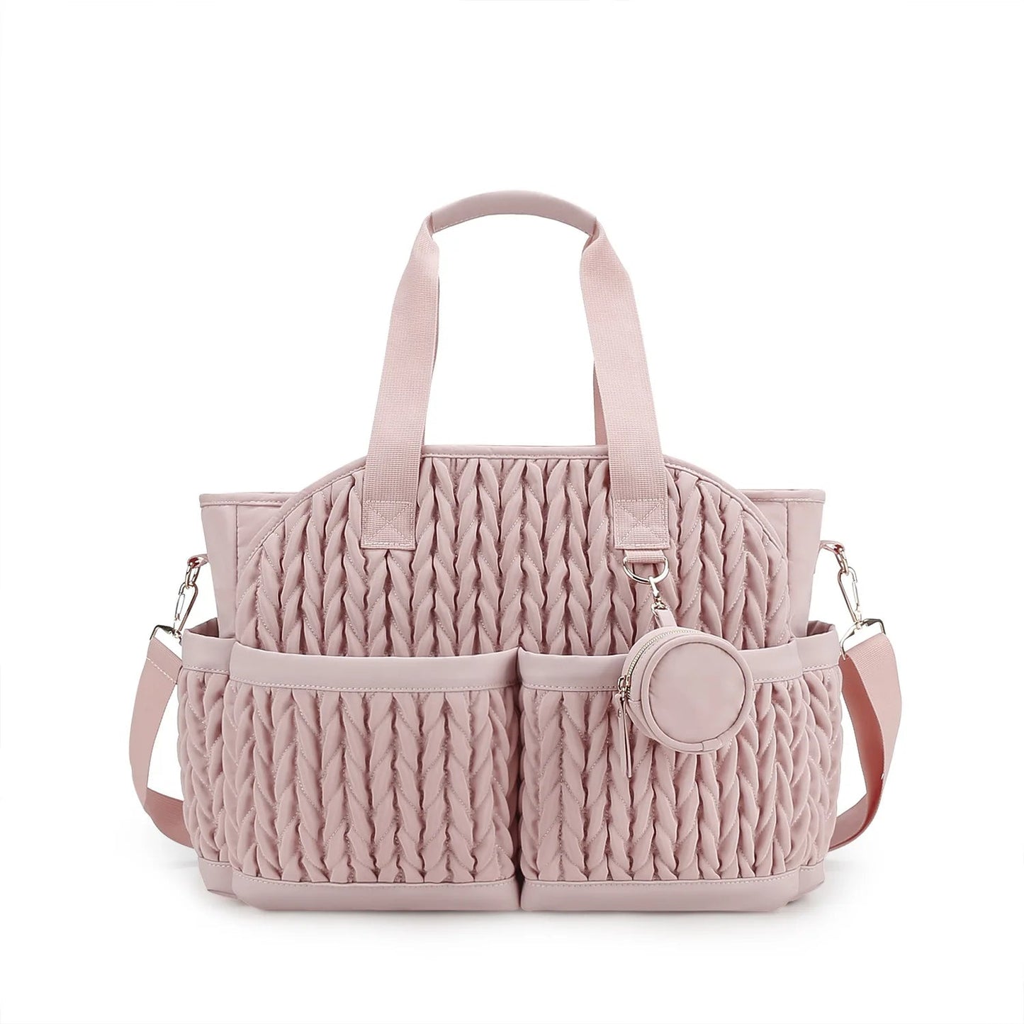 Sac a langer rose au design matelasse elegant avec anses et bandouliere, ideal pour les jeunes mamans
