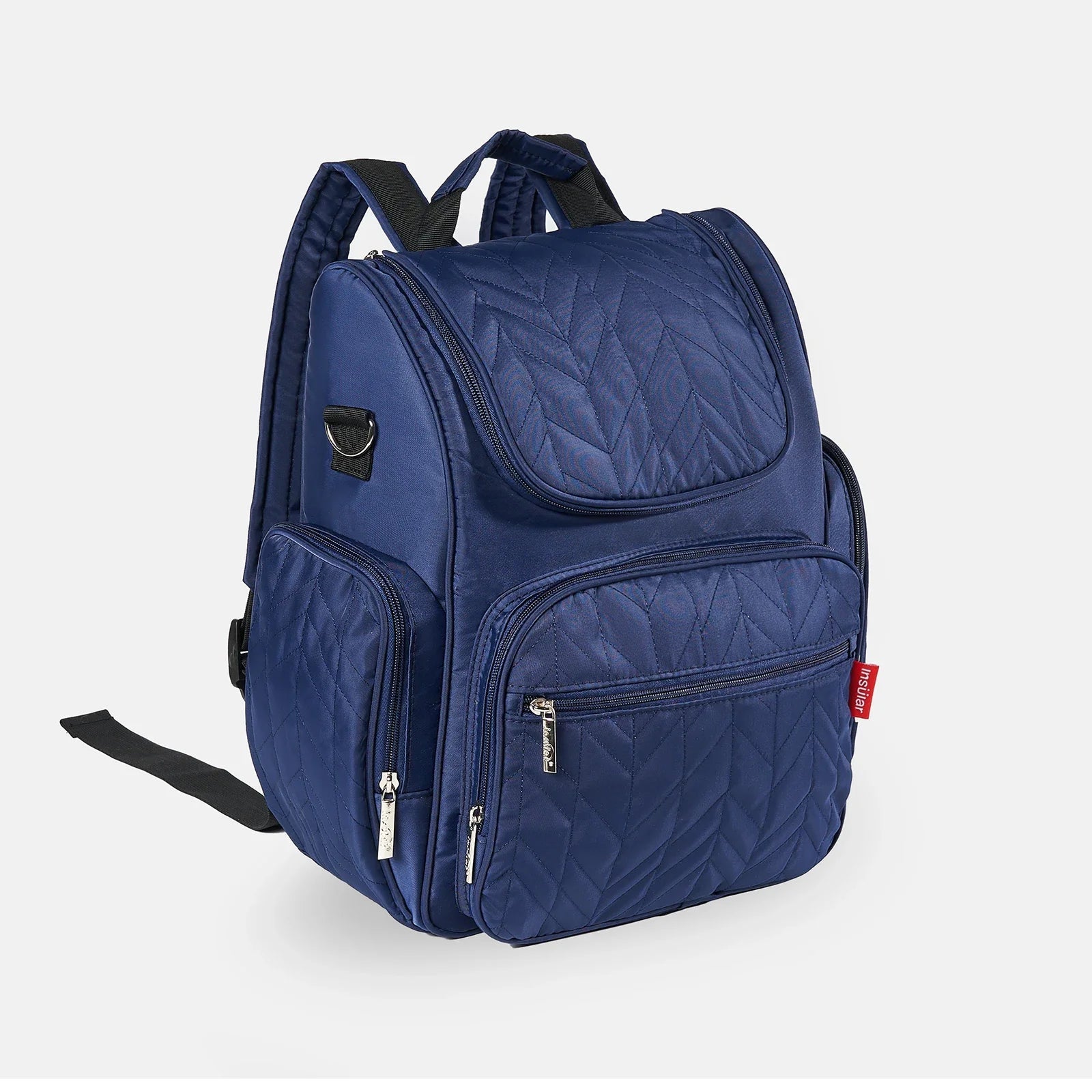 Sac a langer sac a dos bleu marine matelasse, un coloris sobre qui convient aux deux parents.