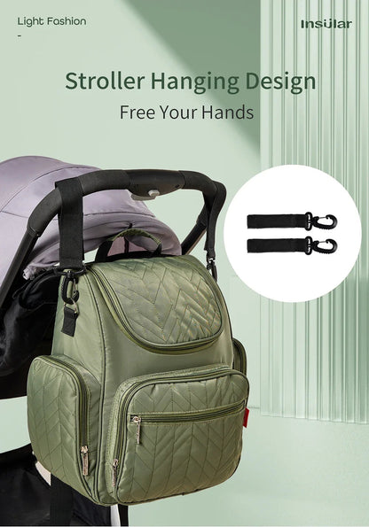 Systeme de crochets permettant de suspendre le sac a la poussette pour se deplacer plus librement.