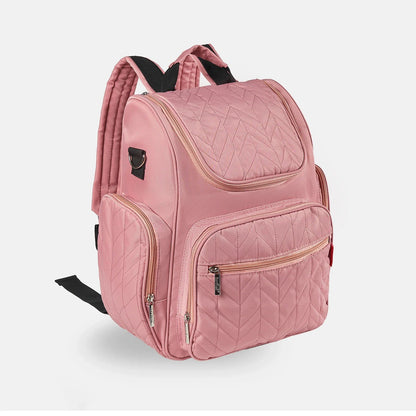 Sac a langer rose vieilli aux fermetures dorees, alliant style et praticite au quotidien.