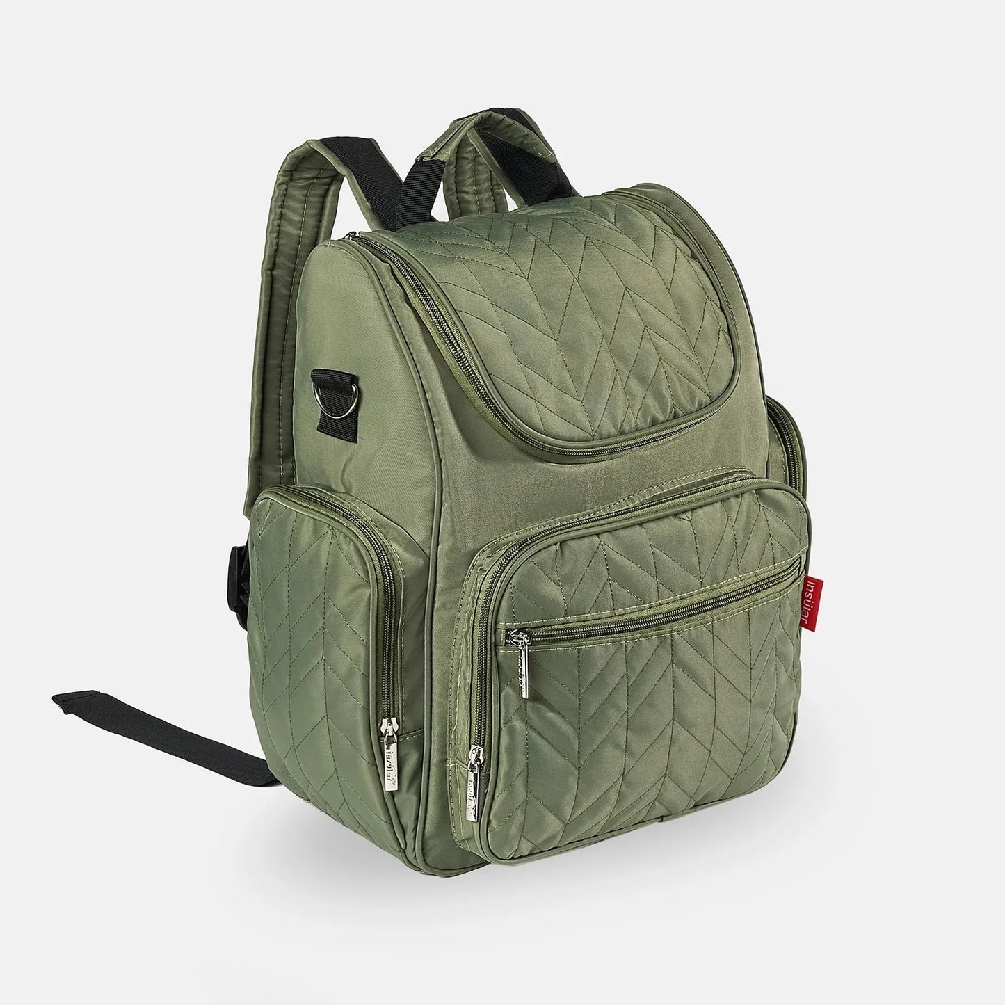 Sac a langer sac a dos vert olive vu de trois quarts, un accessoire discret et raffine pour les sorties.