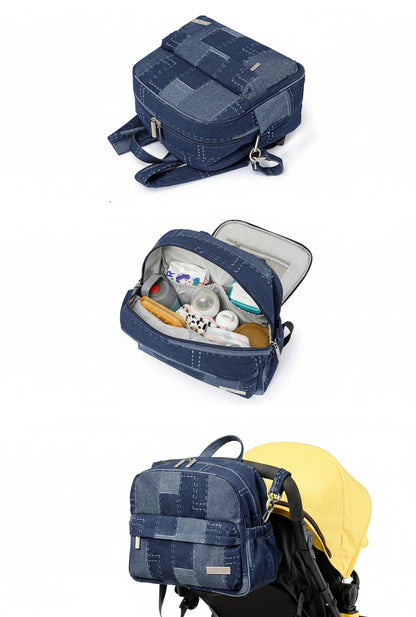 Version denim marine montrant l'organisation complete des affaires de bebe et l'accroche pratique sur la poussette pour liberer les mains.