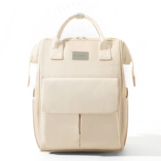 Sac a langer sac a dos beige avec poche frontale spacieuse, ideal pour organiser les affaires de bebe au quotidien.