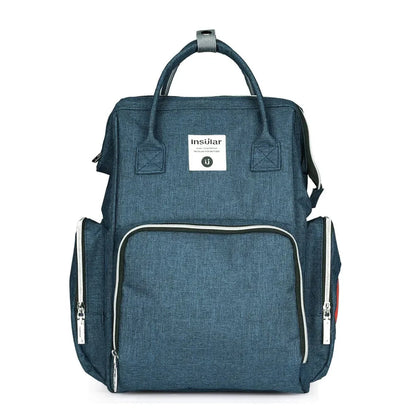Version bleu denim du sac a langer, teinte discrete qui s'accorde facilement avec toutes les tenues.