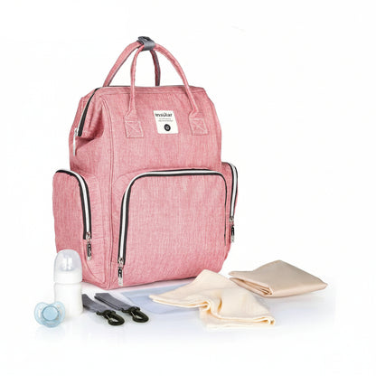 Sac a langer a dos rose Insular livre avec matelas a langer, sangles poussette et pochette etanche pour tout organiser.