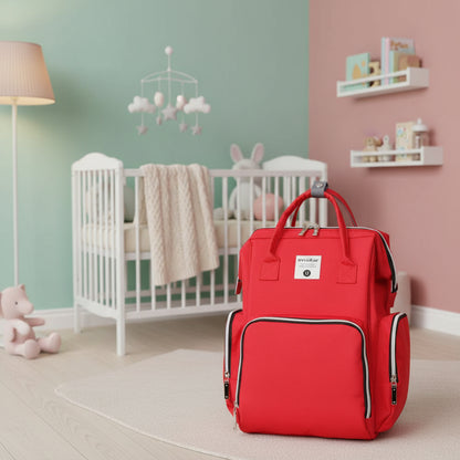 Sac a langer a dos rouge vif au design multipoches pour repartir couches et affaires de bebe.